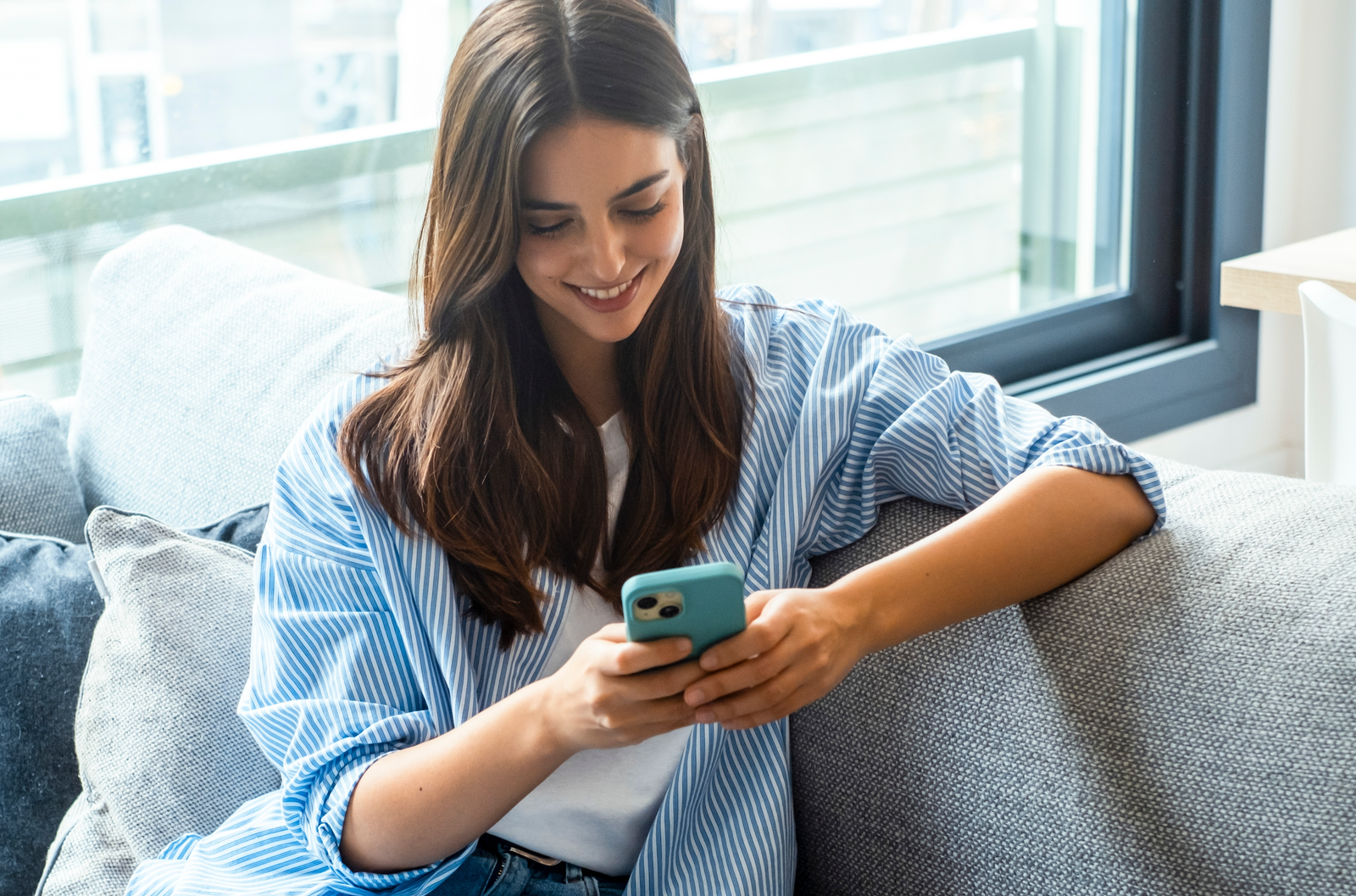 Girl on couch compares home health apps of 2026